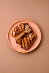 Grilled boneless chicken legs baked on the barbecue for lunch. Grilled chicken as a background