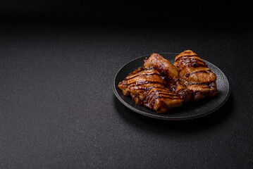 Grilled boneless chicken legs baked on the barbecue for lunch. Grilled chicken as a background