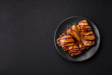 Grilled boneless chicken legs baked on the barbecue for lunch. Grilled chicken as a background