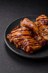 Grilled boneless chicken legs baked on the barbecue for lunch. Grilled chicken as a background