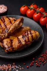 Grilled boneless chicken legs baked on the barbecue for lunch. Grilled chicken as a background