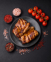 Grilled boneless chicken legs baked on the barbecue for lunch. Grilled chicken as a background