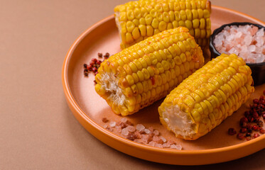 Corn cob cooked in chunks, vegetables, healthy vegetarian food. Boiled corn as a background