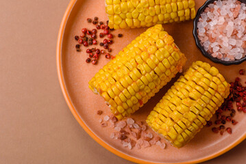 Corn cob cooked in chunks, vegetables, healthy vegetarian food. Boiled corn as a background