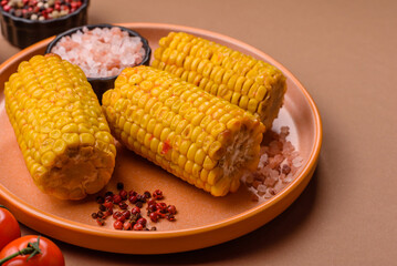 Corn cob cooked in chunks, vegetables, healthy vegetarian food. Boiled corn as a background