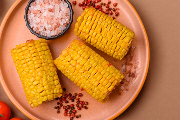 Corn cob cooked in chunks, vegetables, healthy vegetarian food. Boiled corn as a background