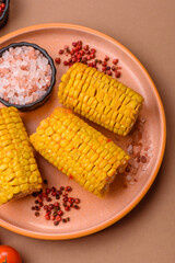 Corn cob cooked in chunks, vegetables, healthy vegetarian food. Boiled corn as a background