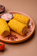Corn cob cooked in chunks, vegetables, healthy vegetarian food. Boiled corn as a background