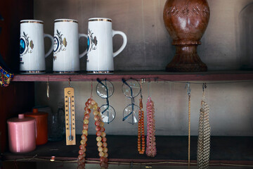 Georgia, Tbilisi - May 2025: extraordinary flea market with assortment of antiques plates, jewelery...