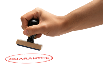 Hand stamping 'GUARANTEE' in bold red seal of approval