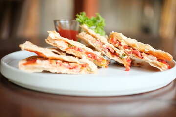 Indulge in artisan pizza with fresh toppings, a delightful meal for sharing or savoring solo at your favorite bistro or cafe now