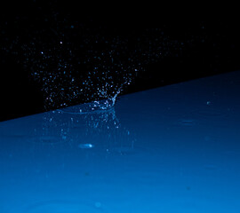 Water splash captured in blue light