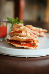 Enjoy delicious crispy pizza snacks with vibrant tomato sauce and fresh herbs, perfect for a casual gathering or tasty appetizer, delightful foodie experience