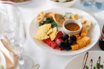cheese platter on a plate at a banquet