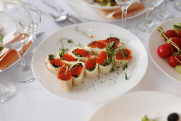 delicious appetizers with caviar on a plate
