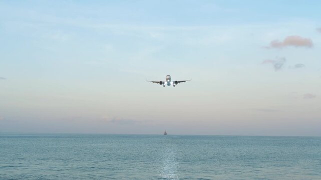 PHUKET, THAILAND - FEBRUARY 23, 2025: Aeroplane Airbus A321, EI-KGG of Air Astana landing at Phuket airport. Plane flying overhead. Travel concept.