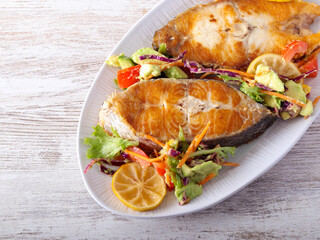 fried white fish with salad