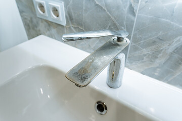 contemporary bathroom fixtures, sleek ceramic sink paired with modern faucet, modern bathroom design includes stylish ceramic sink with sleek chrome faucet and single handle