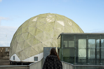 Geodesic dome architecture with person approaching