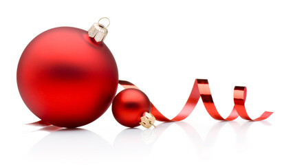 Two red Christmas baubles and curling paper ribbon isolated on white background