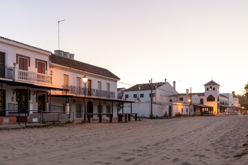 Obraz premium El Rocio, Sevilla, Andalusia, Spain. 28 August 2025. Hermandad house illuminated at dusk
