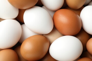 Many raw chicken eggs as background, closeup