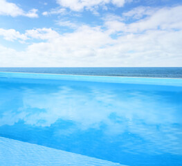 Swimming pool with clear water and infinity view on ocean
