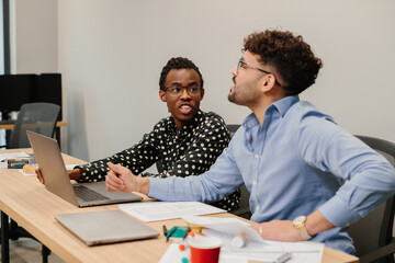Diverse business professionals discussing during office meeting