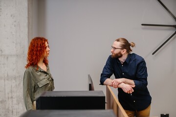 People discussing business strategy in modern office