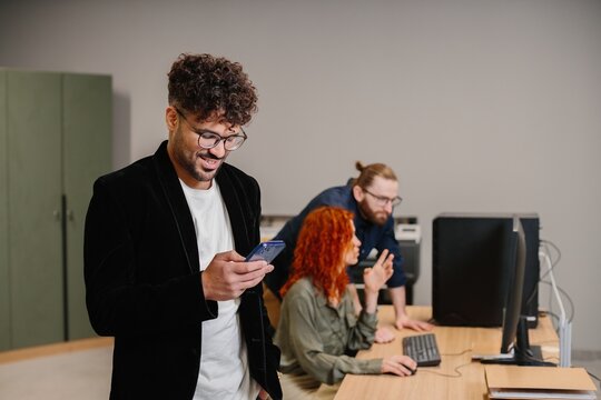 Business colleagues collaborating in a modern office using technology