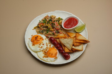 Delicious Breakfast Plate featuring Scrambled Eggs, Crispy Potatoes, and Savory