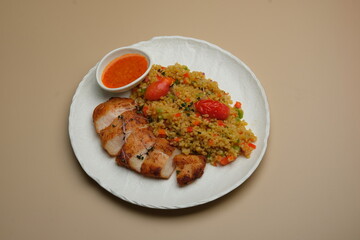 Deliciously Grilled Chicken Served with a Colorful and Nutritious Vegetable