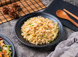Savor the taste of authentic shrimp fried rice, a delightful Asian meal presented with style. Perfect for menus, food blogs, or culinary promotions. Fresh, tasty, and inviting.