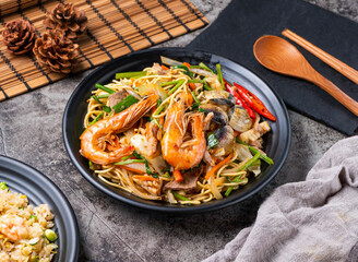 Indulge in this delicious seafood and shrimp stir-fry noodle dish, a culinary adventure ready to eat. Featuring fresh ingredients and vibrant flavors, ideal for your next food blog!