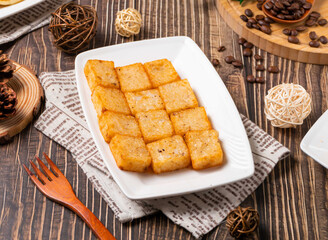 Enjoy these savory turnip cakes, a delicious and authentic culinary experience. Perfect as an appetizer, snack, or brunch addition with coffee in a rustic setting.