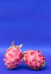 Closeup of Ripe Dragon Fruit or Pitaya Isolated on Blue Background with Copy Space