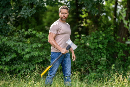 Hardworking brutal man. Lumberjack hardworking outdoor. Brutal lumberjack. Brutality and masculinity. Hispanic lumberjack man with axe. Lumberjack axe. Man with logging axe. Axe in hand - Powered by Adobe
