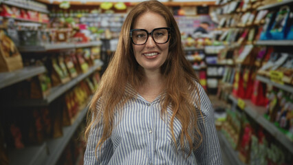 Woman gives thumbs up to groceries on supermarket shelves in a modern indoor grocery aisle; approval.
