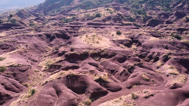 Wide view of the iron-rich red ruffes bordering Salagou Lake, in southern France. These unique clay formations shape the striking landscape of Languedoc. Check my portfolio for more Salagou footage.