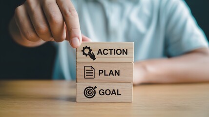 action plan and goal setting concept with wooden blocks for business motivation and productivity strategy