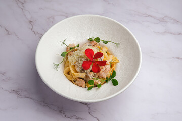 A Deliciously Styled Pasta Dish Beautifully Enhanced with Edible Flowers