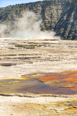 Scenic view of a hot spring and  mineral deposits on Travertine Terraces at the Mammoth Hot Springs in Yellowstone National Park. No people.