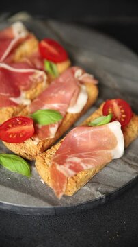 jamon bruschetta prosciutto appetizer portioned tapas dish natural tasty snack fresh delicious gourmet food background on the table rustic top view copy space
