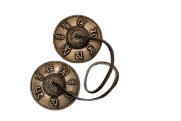 Tibetan tingsha cymbals representing meditation, spirituality, and sound healing