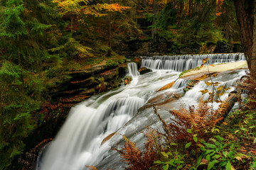 Autumn Waterfall in Mountain Forest with Colorful Foliage