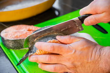Cutting salmon fillet into steaks
