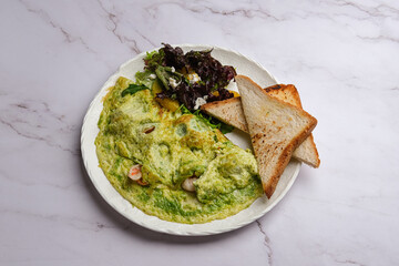 Indulge in a Delicious Avocado Omelette served with Toast and