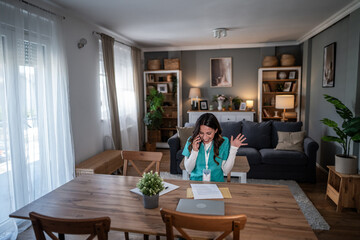 Nurse celebrating good news during telehealth phone call at home