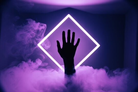Vertical hand silhouette centered behind a bright glowing neon purple diamond frame surrounded by dense violet smoke abstract futuristic and digital art concept