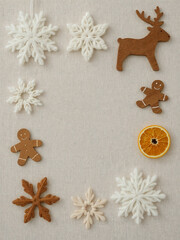 Decorative winter holiday display featuring gingerbread cookies and snowflakes on a light background